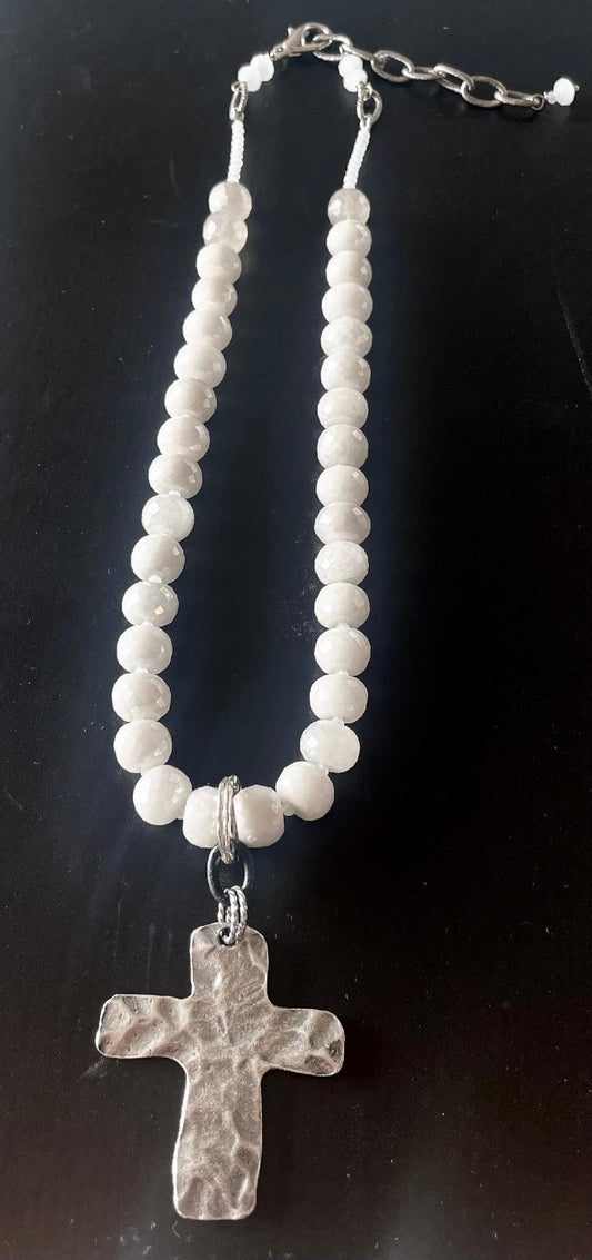 White necklace with cross